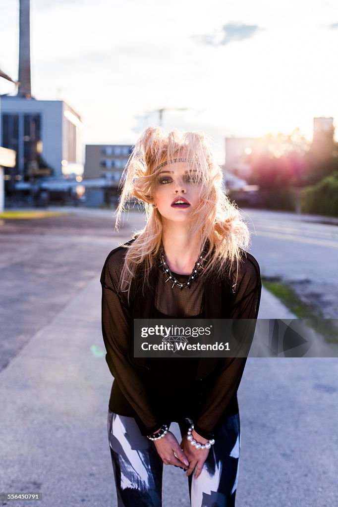 Portrait of blond woman shaking hair