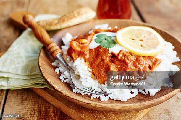 seitan tikka masala on rice with soy yogurt and served with paratha bread - seitan foto e immagini stock