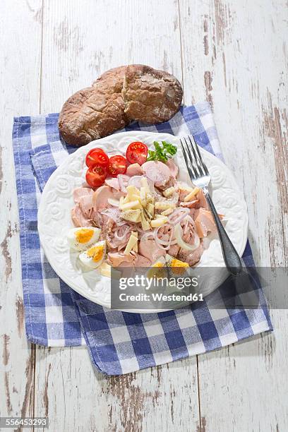 sausage salad with cheese, egg and tomato on plate - cheese salad stock-fotos und bilder