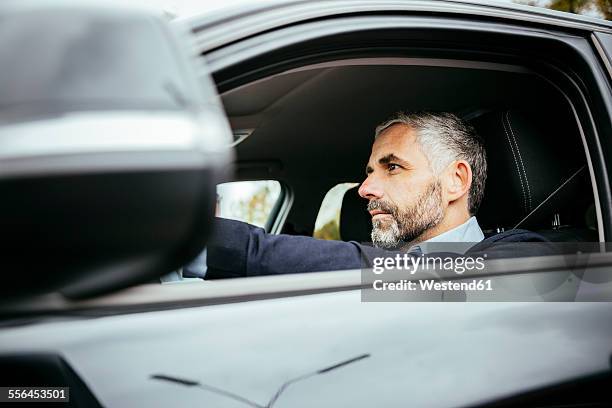 man driving car - car profile stock pictures, royalty-free photos & images