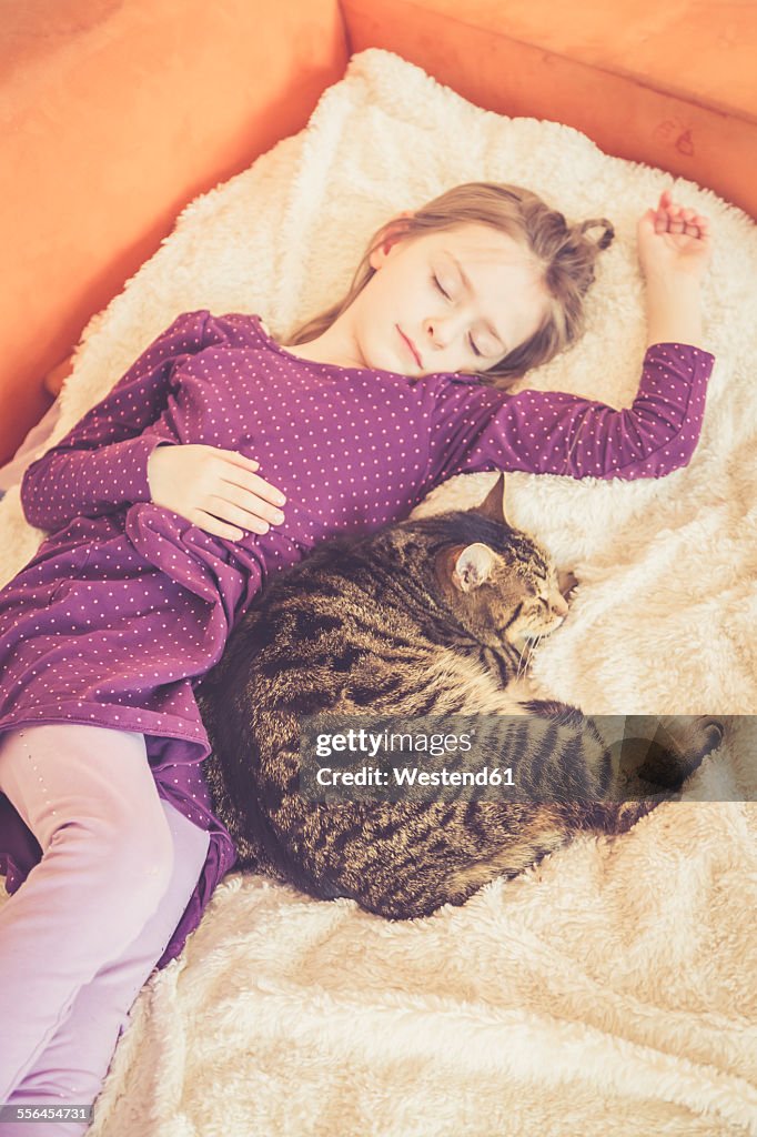 Girl and cat sleeping
