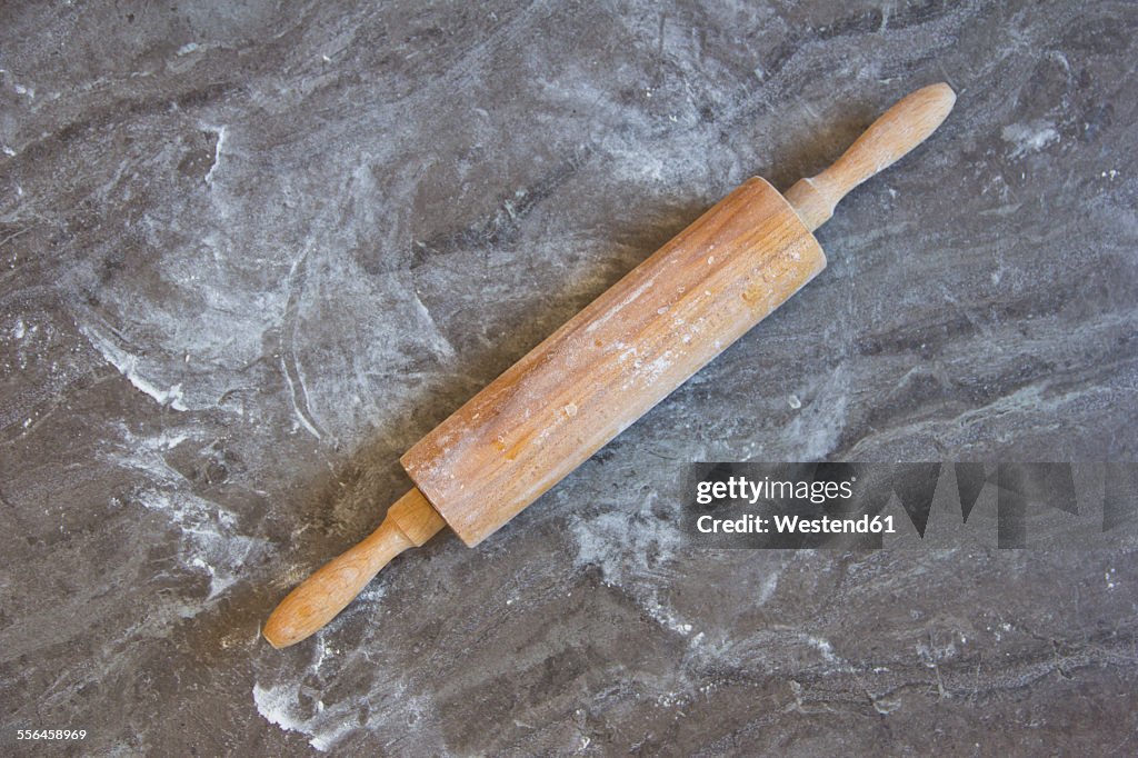 Rolling pin on floured kitchen worktop