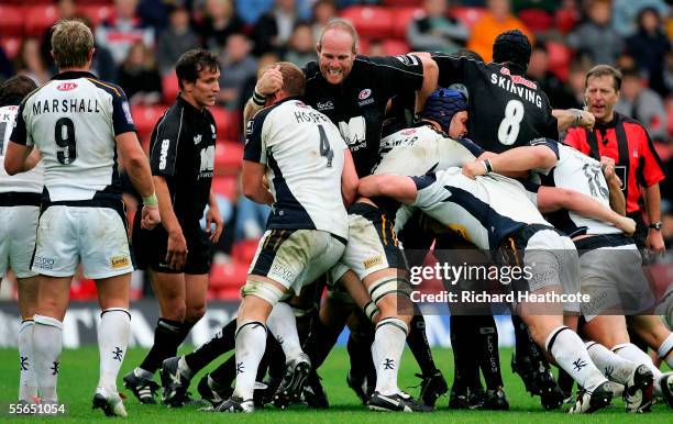 Kris Chesney of Saracens gets to grips with Stuart Hooper of Leeds during the Guinness Premiership match between Saracens and Leeds Tykes at Vicarage...