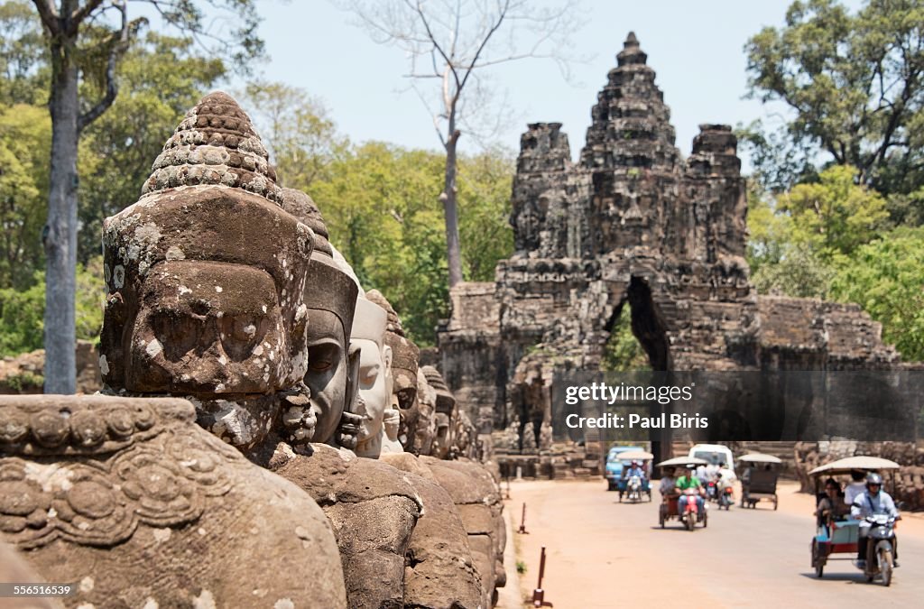 Gate entrance to Angkor Thom with guarding statues