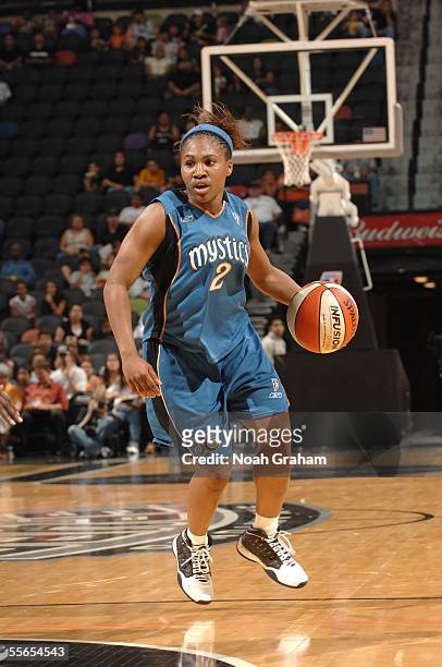 Temeka Johnson of the Washington Mystics drives upcourt during the game against the San Antonio Silver Stars on June 7, 2005 at SBC Center in San...