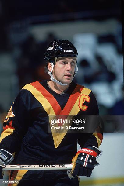 Canadian hockey player Stan Smyl, captain of the Vancouver Canucks, on the ice during a road game, 1980s.