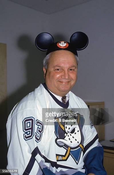 Portrait of American hockey executive Jack Ferreira, general manager of the Anaheim Mighty Ducks, smiling and wearing Mickey Mouse ears, 1990s. The...