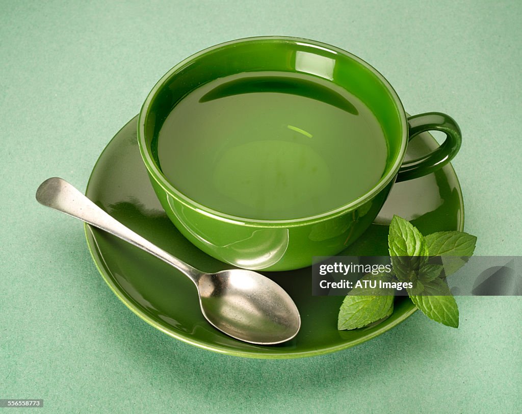 Green tea on green background