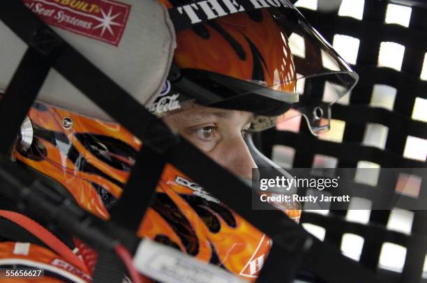 Tony Stewart, driver of the Home Depot Chevrolet, looks on during practice for the NASCAR Nextel Cup Sylvania 300 on September 16, 2005 at New...