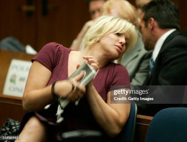 Actress/musician Courtney Love and attorneys Howard Weitzman and Michael Rosenstein appear at a sentencing for probation violations at the Clara...
