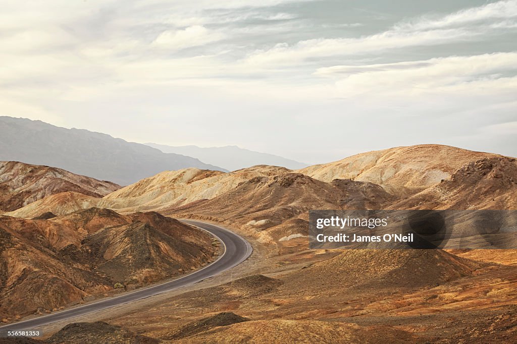 Curved road in rocky landscape