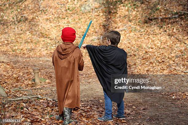 friends exploring woods - laser sword stock pictures, royalty-free photos & images