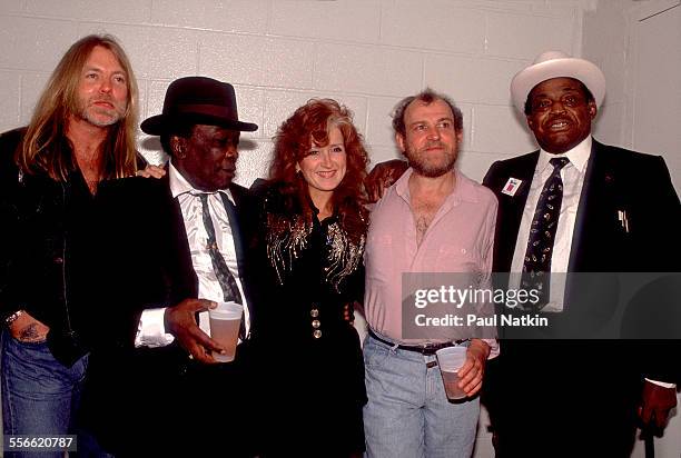 Backstage portrait of, from left, musicians Greg Allman, John Lee Hooker , Bonnie Raitt, Joe Cocker , and Willie Dixon as they pose at Madison Square...