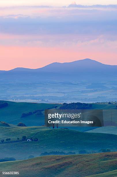Val d'Orcia. Orcia Valley at dawn, Morning fog, UNESCO World Heritage Site, San Quirico d'Orcia. Siena Province, Tuscany landscape, Italy, Europe.