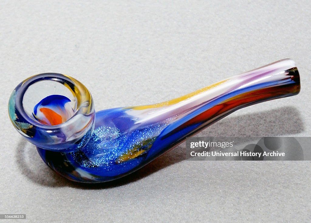 A glass Meth Pipe for inhaling Methamphetamine (also called methylamphetamine, desoxyephedrine, Crystal Meth (or just meth) a man-made stimulant drug.