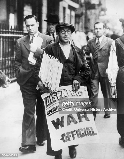 Newspaper seller in London with banner declaring the outbreak of World war two, 1939.