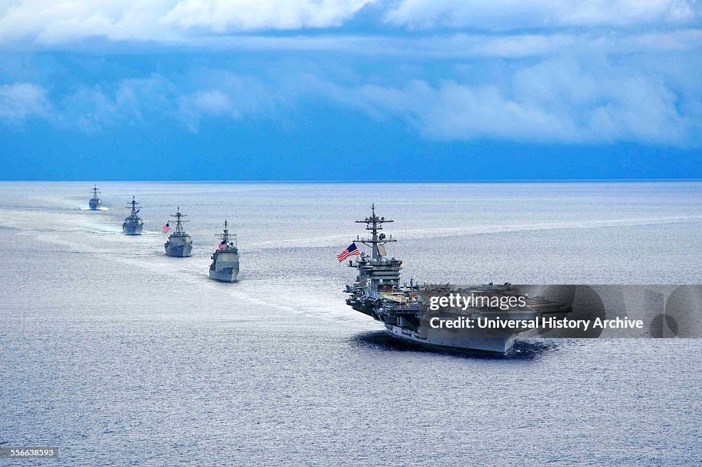 Atlantic Ocean. The aircraft carrier USS Theodore Roosevelt leads a formation of ships from Carrier Strike Group 12 during a manoeuvring exercise. The Theodore Roosevelt participated in the exercise with the Peruvian submarine BAP Islay, (SS 35), the