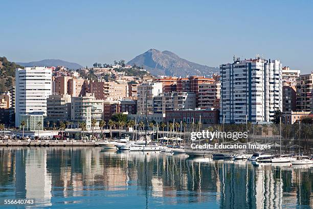 Apartment blocks and yachts in marina of Muelle Uno port development, city of Malaga, Spain.
