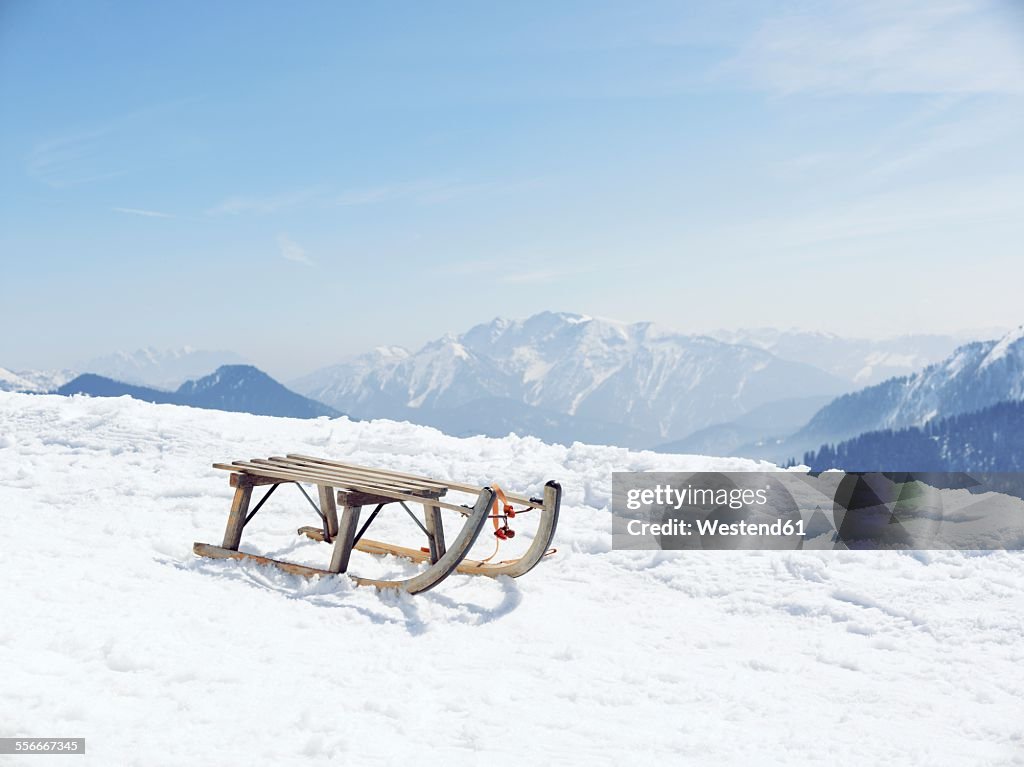 Germany, Tegernsee, sledge standing on Wallberg