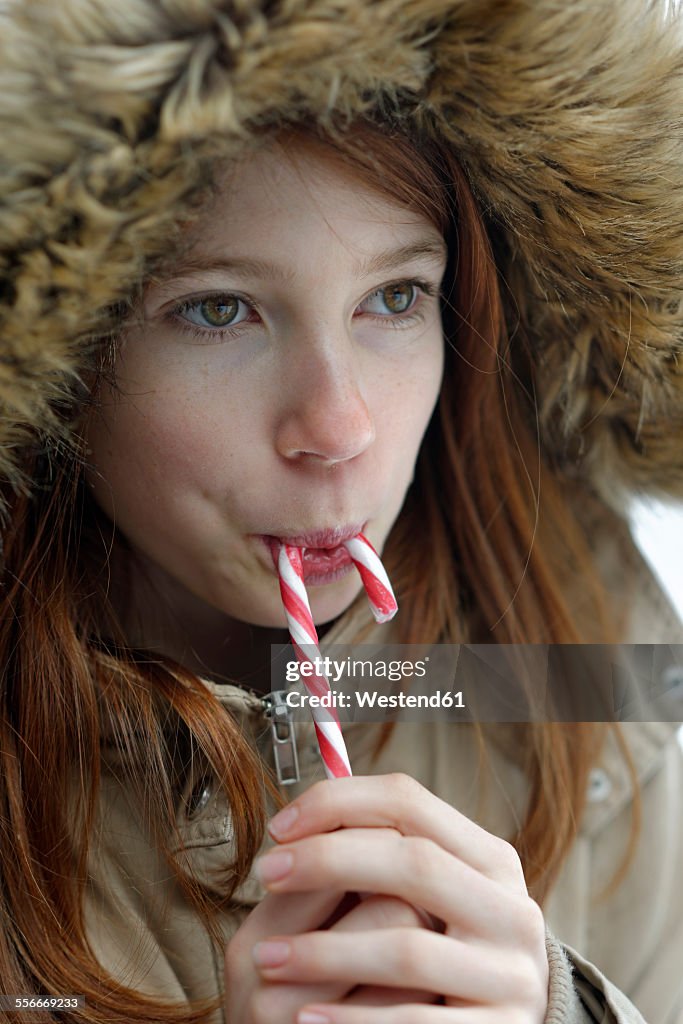 Girl enjoying candy cane
