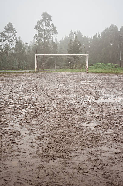 spain, galicia, valdovino, muddy soccer field on a rainy day - muddy football pitch stock pictures, royalty-free photos & images