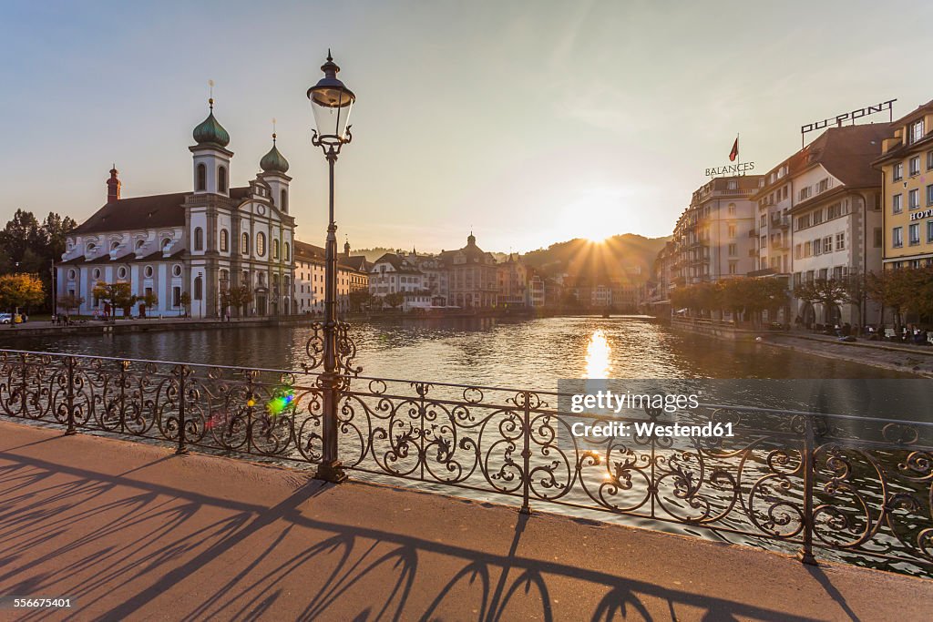 Switzerland, Canton of Lucerne, Lucerne, Old town, Reuss river, Jesuit church at sunset