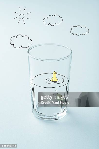 glass cup and picture of handwriting - water bird stock-fotos und bilder