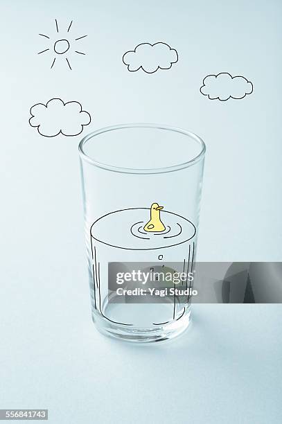 glass cup and picture of handwriting - water bird stock pictures, royalty-free photos & images