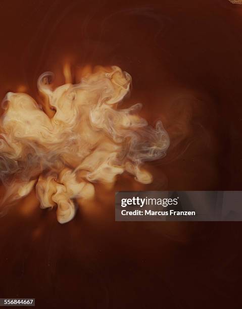 close up of milk in coffee - mixing stock pictures, royalty-free photos & images