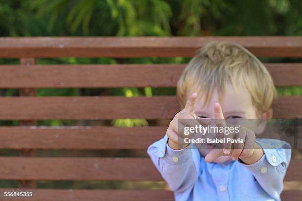 boy pointing two fingers - number 2 stock pictures, royalty-free photos & images