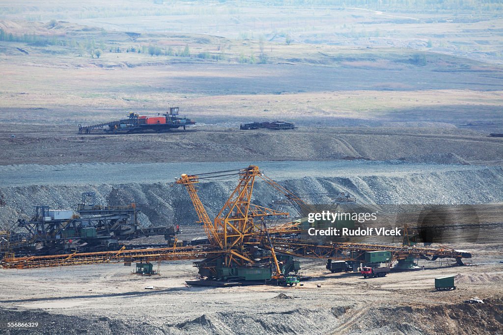 Open pit coal mine with heavy mining machinery