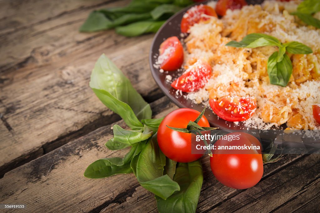 Pasta with chicken, tomato, basil and cheese