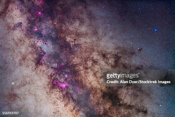 the milky way around the small sagittarius star cloud. - nebulosa del águila fotografías e imágenes de stock