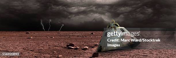 a scorched space capsule lies abandoned on a barren world. storm clouds and lightning are the background of a failed mission. - planets colliding stock pictures, royalty-free photos & images