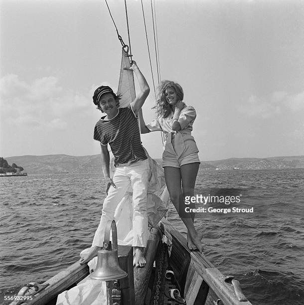English actor, David Hemmings and his girlfriend, American actress, Gayle Hunnicutt, relaxing on a yacht in Istanbul, Turkey, 28th July 1967.