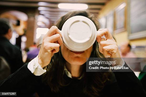 woman eating broth from bowl - suppenschüssel stock-fotos und bilder