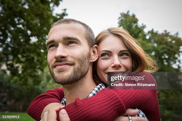 close up of romantic young couple outdoors - young couple hugging stock pictures, royalty-free photos & images