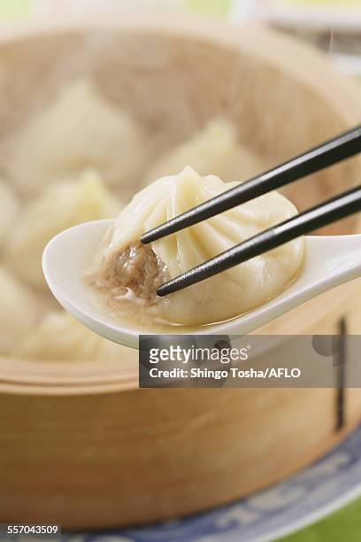 dim sum dumplings - holding chopsticks stock pictures, royalty-free photos & images