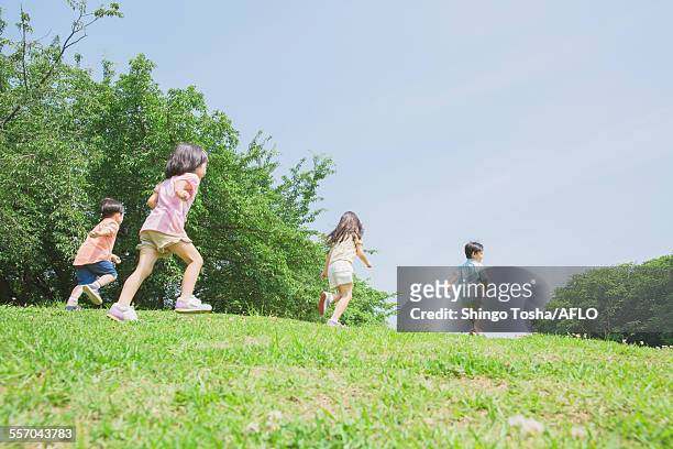 japanese kids playing in a park - only kids at sky stock pictures, royalty-free photos & images