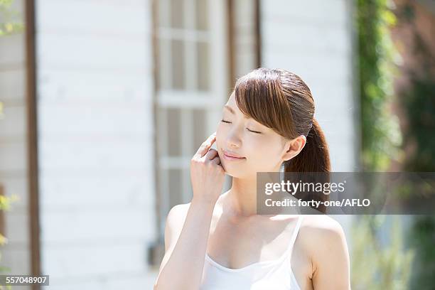 attractive young girl portrait - woman smiling eyes closed stock pictures, royalty-free photos & images