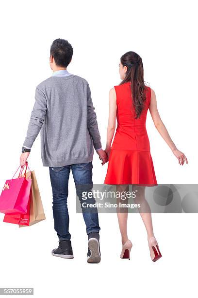 young couple shopping happily - multi colored skirt fotografías e imágenes de stock