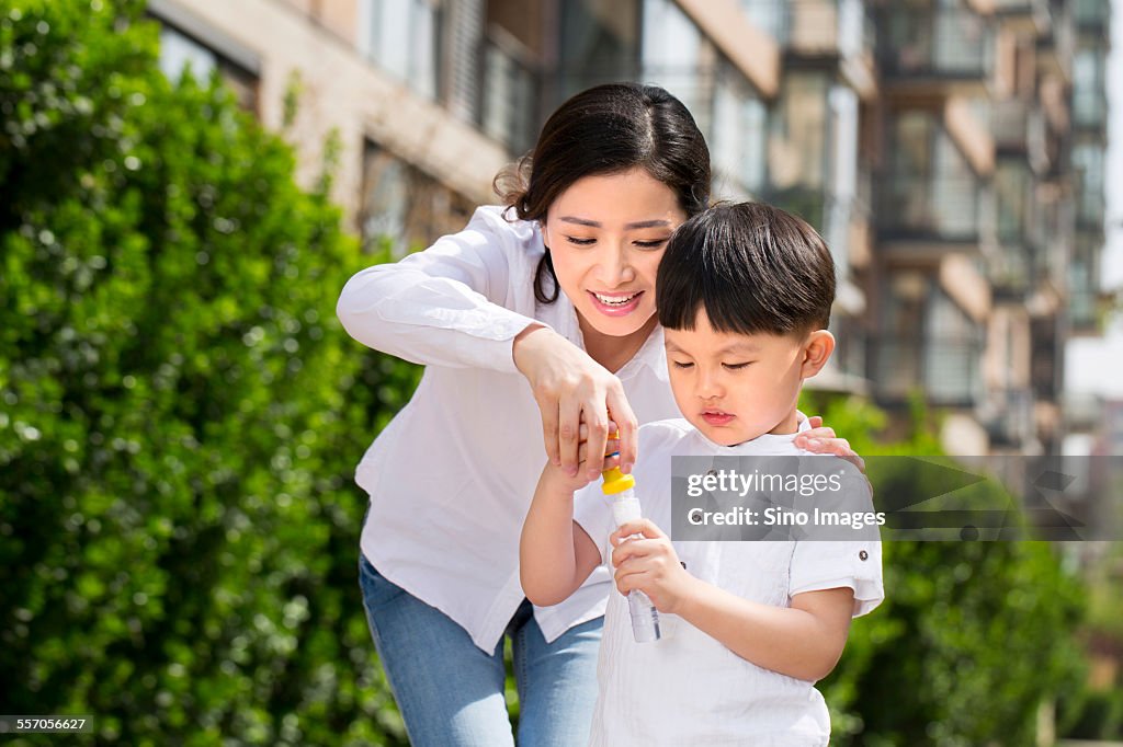 Young Mother Playing Games with Her Son