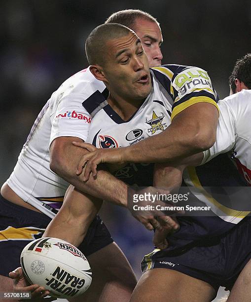 Paul Rauhihi of the Cowboys offloads the ball during the NRL Semi Final between the Melbourne Storm and the North Queensland Cowboys at Aussie...