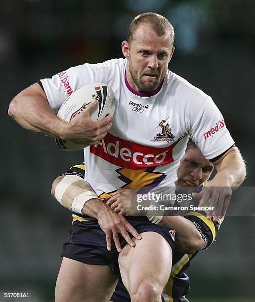 Scott Hill of the Storm is tackled during the NRL Semi Final between the Melbourne Storm and the North Queensland Cowboys at Aussie Stadium September...