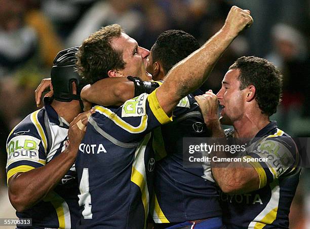 Paul Bowman of the Cowboys celebrates a Cowboys try with team mates during the NRL Semi Final between the Melbourne Storm and the North Queensland...