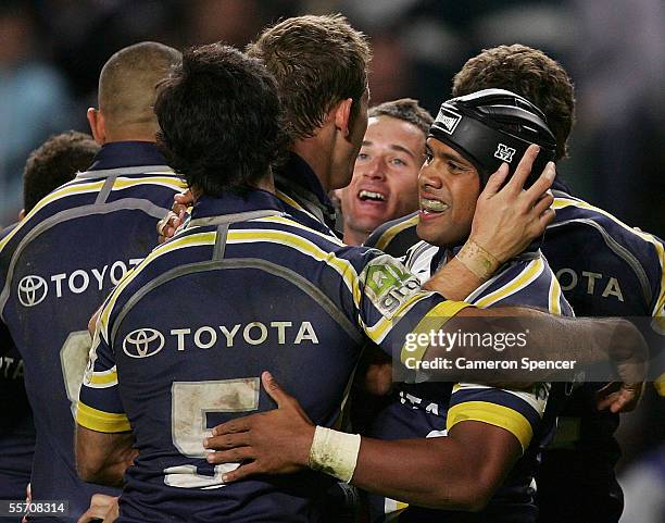 Ty Williams of the Cowboys celebrates a Cowboys try with team mates during the NRL Semi Final between the Melbourne Storm and the North Queensland...