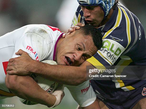 David Kidwell of the Storm is tackled during the NRL Semi Final between the Melbourne Storm and the North Queensland Cowboys at Aussie Stadium...