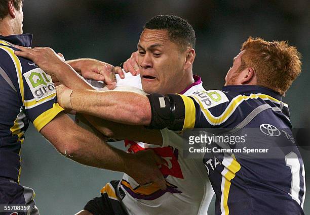 David Kidwell of the Storm is tackled during the NRL Semi Final between the Melbourne Storm and the North Queensland Cowboys at Aussie Stadium...