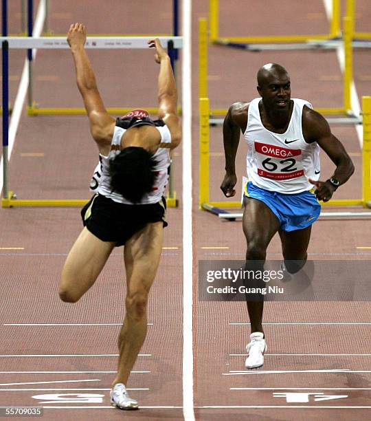 Liu Xiang of China and Allen Johnson of the US in action during the men's 110m hurdles at the Shanghai Golden Grand Prix on September 17, 2005 in...