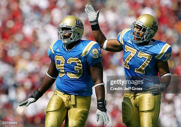 Brigham Harwell and Kenneth Lombard of the UCLA Bruins celebrate after a sack during their game against the Oklahoma Sooners on September 17, 2005 at...